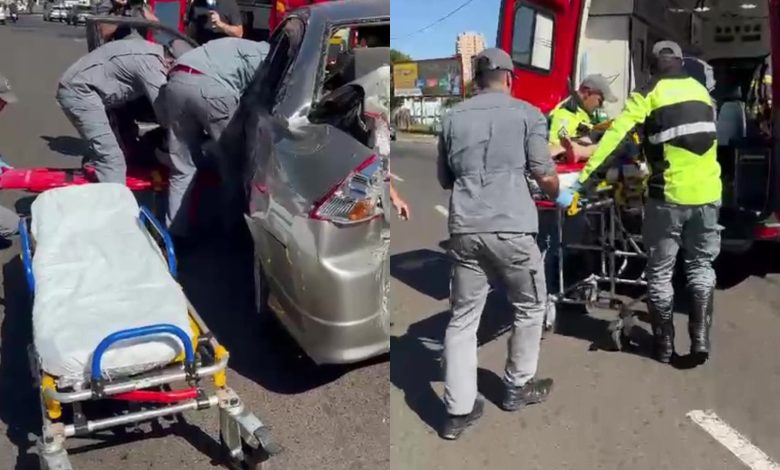 Equipes de resgate retiram motorista presa às ferragens após acidente entre ônibus e carro na Avenida Integração